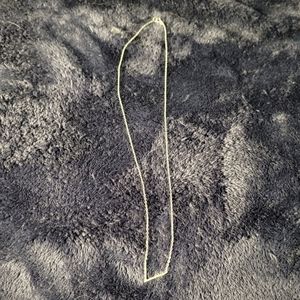 Silver necklace with 'v' shape charm